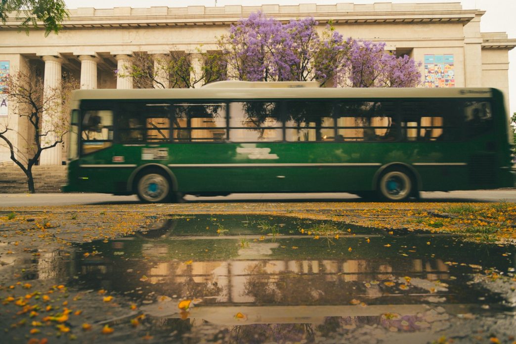 Colectivo driving along a Buenos Aires avenue, illustrating the Buenos Aires bus fare
