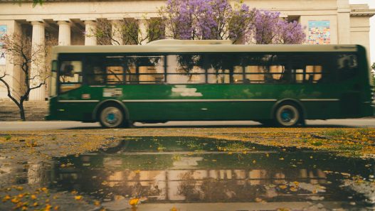 Colectivo driving along a Buenos Aires avenue, illustrating the Buenos Aires bus fare