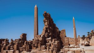 Egyptian obelisks at the Karnak temple complex in Luxor under a clear blue sky
